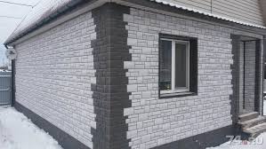 Фасад из сайдинга под камень